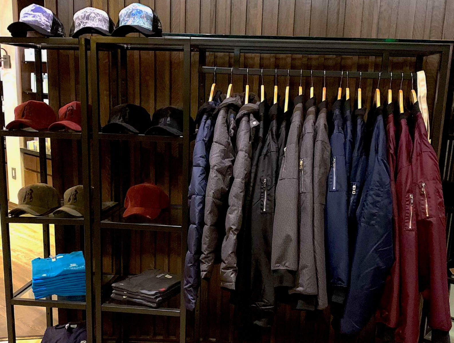 Custom outerwear and caps displayed at St. Regis Aspen