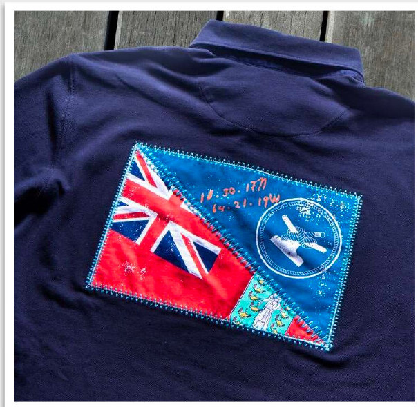 Close-up of original embroidered artwork on the back of a navy rugby shirt